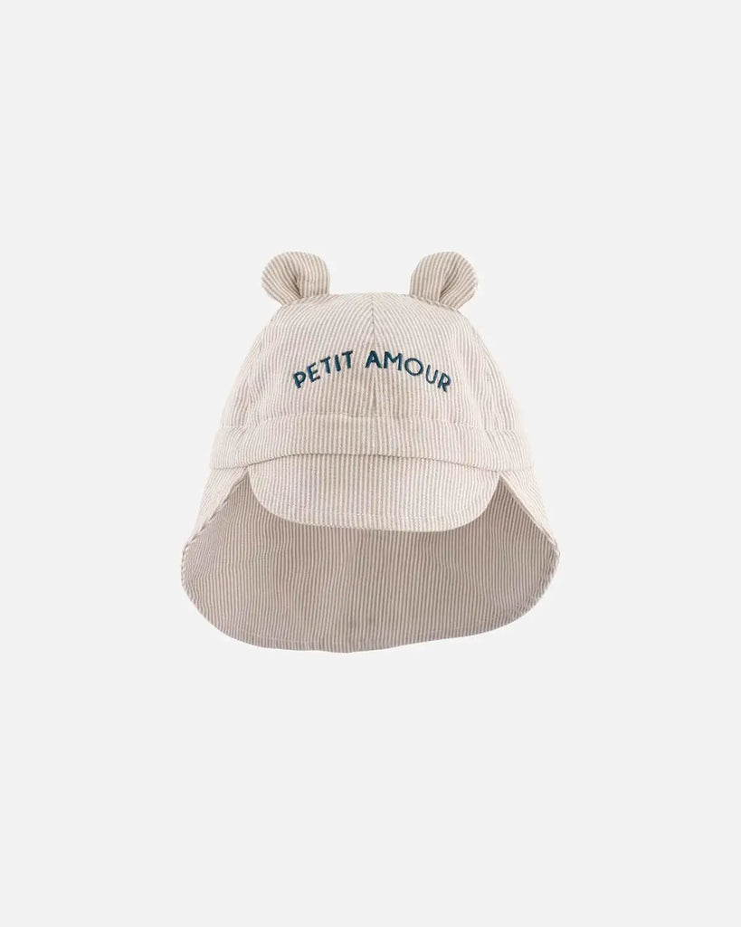 Chapeau pour bébé à rayures beiges et broderies bleues "Petit amour" de la marque Bobine Paris.