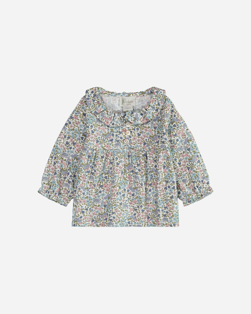 Blouse Ava fleurs bleues avec un col claudine.